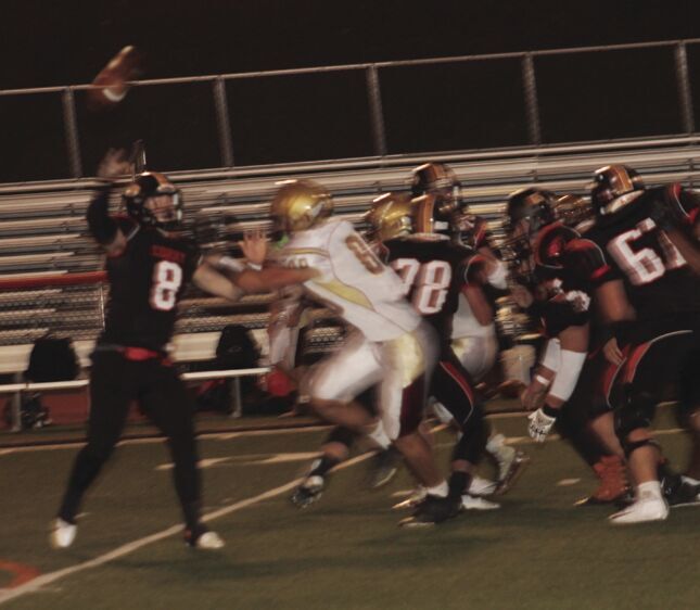 quarterback Nate Lesher (8) throws deep.